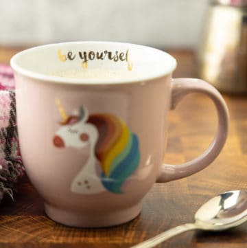 Pumpkin spice latte in a unicorn pink cut that says "Be Yourself"