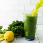 Immunity boosting green kale cucumber smoothie with celery and lemon.